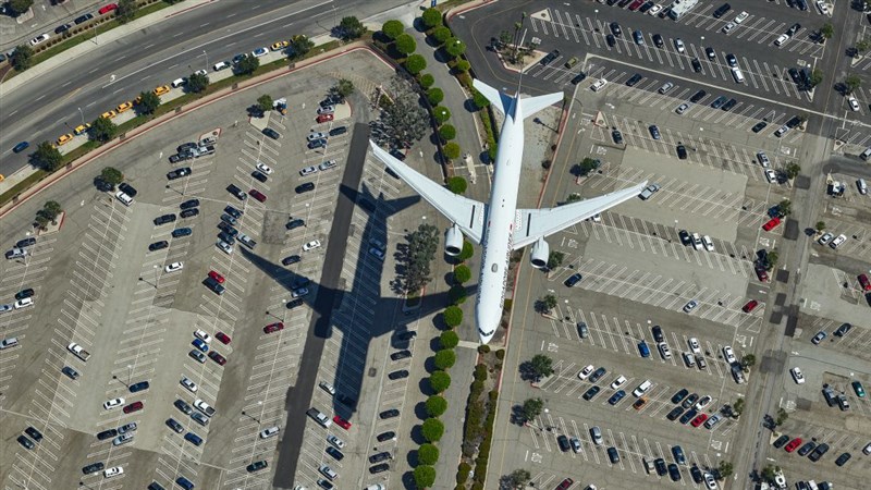 Meet the daredevil photographer who hangs out of helicopters to take photos